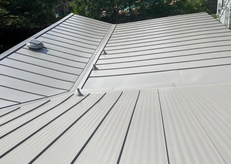 Solar attic fan installed on a metal roof for Roof Ventilation in Madera Acres